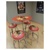 Blackhawks table and 4 stools- table is 27.5 in diameter and 43.5 inches tall. Stools are 15 inches 