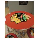 Blackhawks table and 4 stools- table is 27.5 in diameter and 43.5 inches tall. Stools are 15 inches 