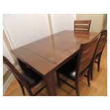 Kitchen table with one leaf self store, 4 chairs and one bench.  $200.00  Table has some wear.  