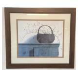 Framed and mounted print of a basket on a