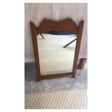 Wood framed wall mirror. Measures approximately