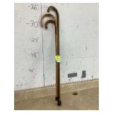 Antique wooden walking sticksGold ring with green gem