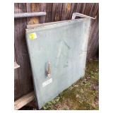 Two large metal electrical box doors