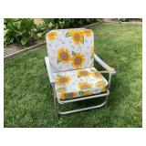 Old metal chair with cushions