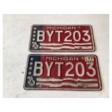 Two matching 76 Michigan plates