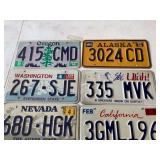 collection of old and different state license plates