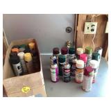 Various spray paint cans in different colors