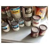 Various partially used automotive paint cans