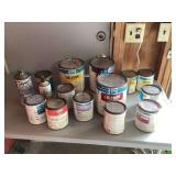 Various half-used car paint cans