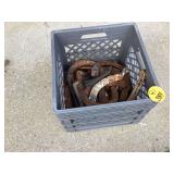 Assorted horseshoes in crate