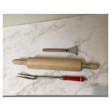 Old kitchen tools rolling pin whisk fork