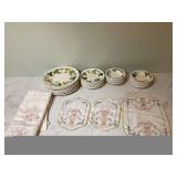 Old dishes and fancy tablecloths