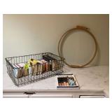 Crate with books and quilt hoop