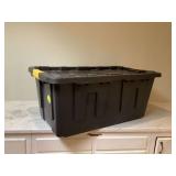 Large storage tote with blanket and clothes