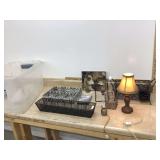 Various organizers photos and lamps in open tote