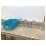 Assorted glass jars in bin