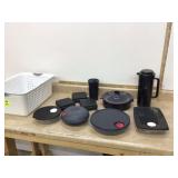 Tupperware set with steamer pitcher sandwich containers in plastic basket