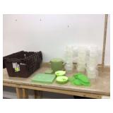 Various green Tupperware containers with lids