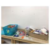 Gift wrapping supplies in tote with lid