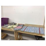 Various rugs in tote without lid