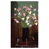 Artificial plant and black vase